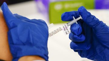 FILE - A health worker administers a dose of a Moderna COVID-19 vaccine during a vaccination clinic in Norristown, Pa. on Dec. 7, 2021. In a reversal for President Joe Biden, a federal appeals court in New Orleans on Monday, June 27, 2022, agreed to reconsider its own April ruling that allowed the administration to require federal employees to be vaccinated against COVID-19. (AP Photo/Matt Rourke, File)