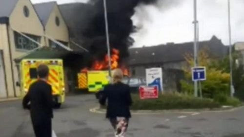 Man being rushed to hospital dies after ambulance bursts into flames 