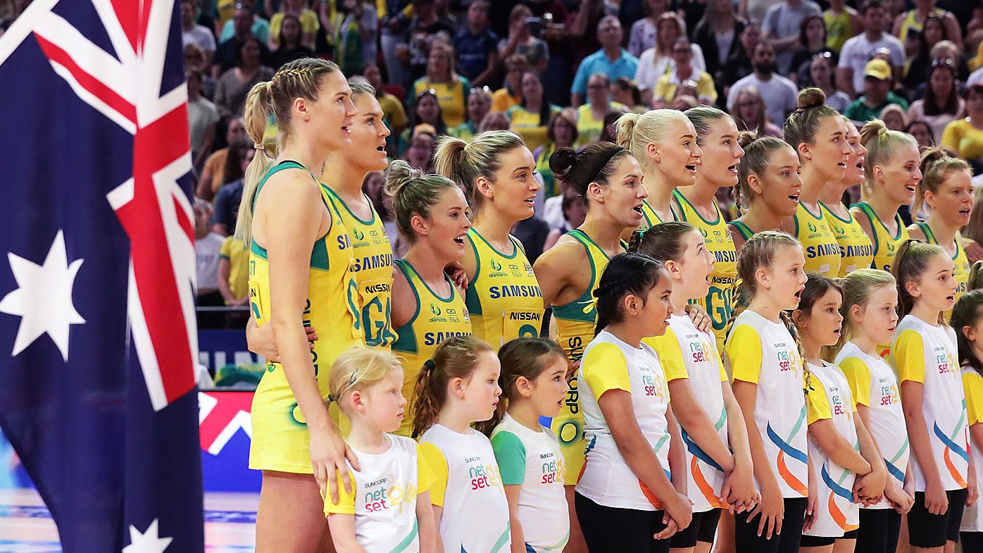 Aussie Diamonds line up for the national anthem