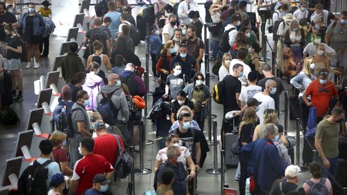 Queues at Sydney Airport today as school holidays kicks off in NSW.