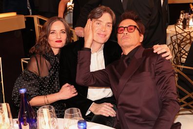Cillian Murphy and Robert Downey Jr. with Murphy's wife Yvonne McGuinness