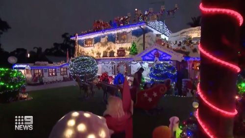 Christmas lights adorn the home of Peter and Lauraine Overton. 