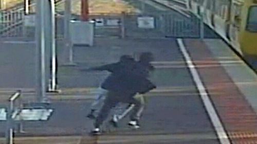 An Adelaide man tried to push his teenage girlfriend in front of a moving train.