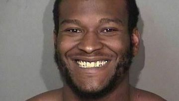 Demetris Nelson grinned in his mugshot after he was arrested for shooting two gay men.