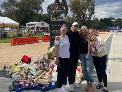 Brooke Warne, Jackson Warne, Simone Callahan and Summer Warne in front of Shane Warne's statue at the Melbourne Cricket Ground