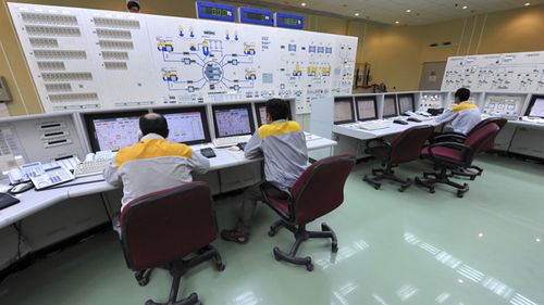 Iranian technicians work at the Bushehr nuclear power plant, outside the southern city of Bushehr, Iran.