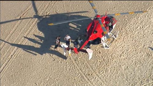 A rescue helicopter is at the scene. (9NEWS)