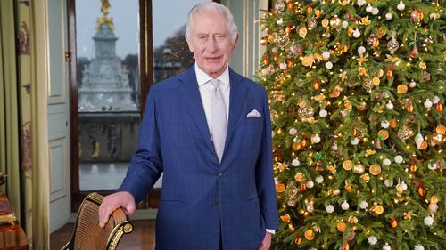 King Charles III during the recording of his Christmas message at Buckingham Palace, London.