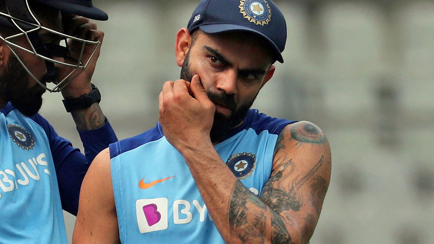 India&#x27;s Shikhar Dhawan, left, chats with captain Virat Kohli as they attend a training session ahead of their first one-day international cricket match against Australia