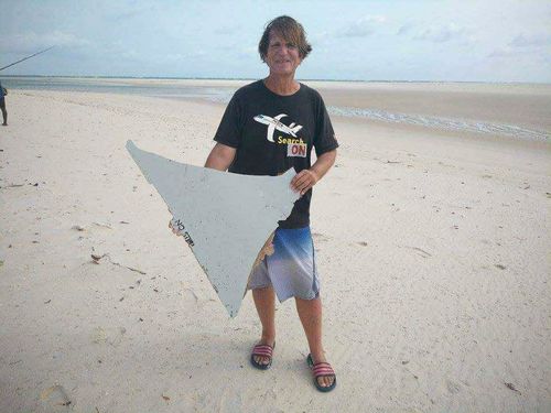 Independent MH370 searcher Blaine Gibson holds the piece of the plane that became known as 'No Step'. 
