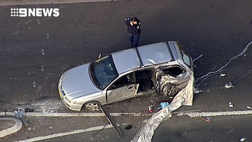 The woman travelling in the car died at the scene. (9NEWS)