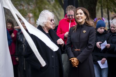 Denmark's Queen Mary and artist Kirsten Justesen, left, at the unveiling of the monument for Countess Danner at Danner in Copenhagen, Monday, Nov.25, 2024.  (Ida Marie Odgaard/Ritzau Scanpix via AP)