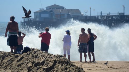 Huge waves caused by Hurricane Marie have drawn crowds of people to southern California beaches. (Getty)