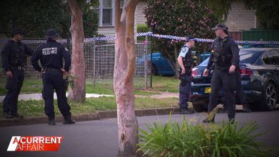 Police outside Drew Douglas' family home at St Marys in western Sydney.