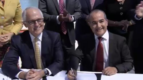 Mr Turnbull and Mr Merlino were all smiles. (9NEWS)