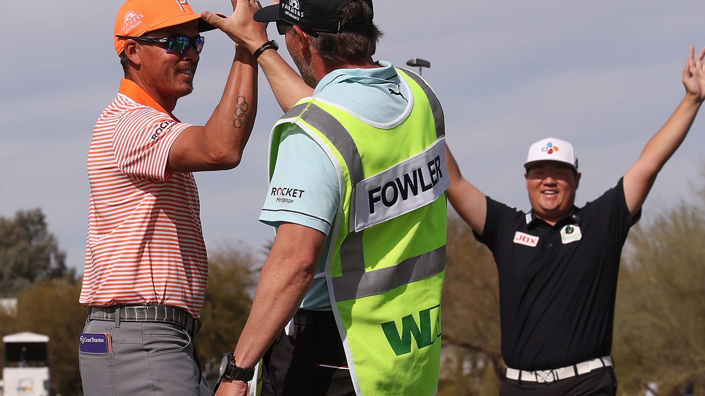 Rickie Fowler celebrates a hole-in-one during the final round of the Phoenix Open.