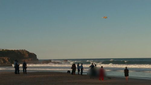 The man was given CPR on the beach. (9NEWS)