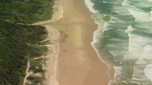 Police have been left "traumatised" after a 19-year-old Canadian woman was found dead and surrounded by 10 dingoes on the Queensland island of K'gari this morning.