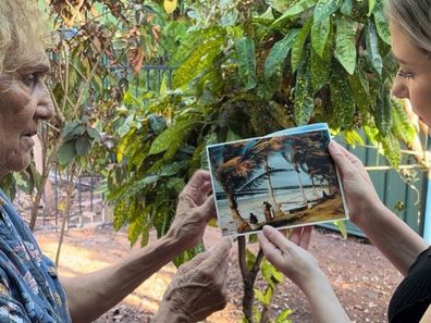 Linda shows Jess Beck a photo of Croker Island north of Darwin, where she and the other First Nations children were left behind.