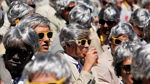 The former cricketer and commentator attracted a cult following among cricket fans, who often mimicked his look. (Getty Images)