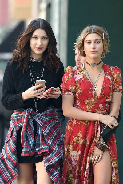 BFFs Hailey Baldwin and Bella Hadid hold hands as they walk together after doing a photo shoot on April 2, 2015 in New York.