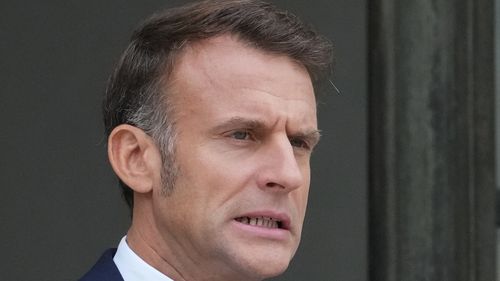 French President Emmanuel Macron waits for Jordan's Crown Prince Hussein at the presidential Elysee Palace, Wednesday, Oct. 8, 2025 in Paris. (AP Photo/Michel Euler)