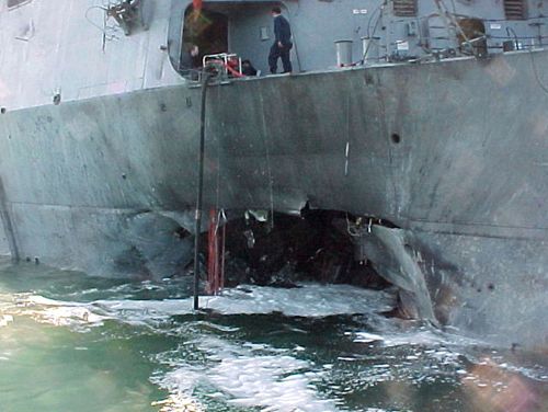 Damage sustained on the USS Cole after a terrorist bomb exploded during a refuelling operation in the port of Aden, Yemen.