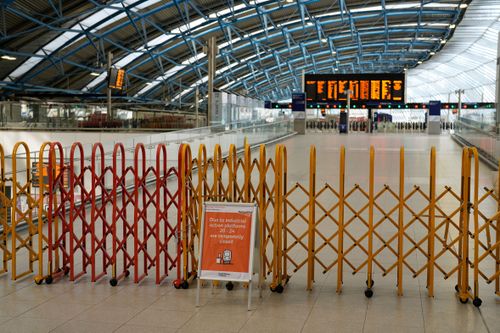 A sign states some platforms are closed during the industrial action at Waterloo railway station in London, Tuesday, June 21, 2022.