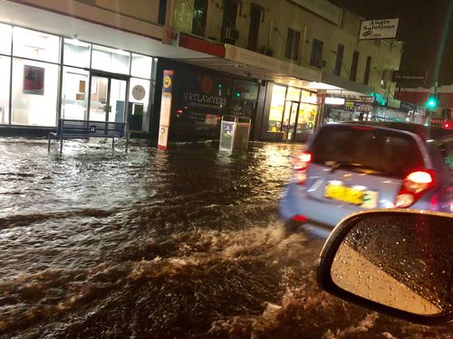 Roads in Mascot near the airport are flooded in the weather.