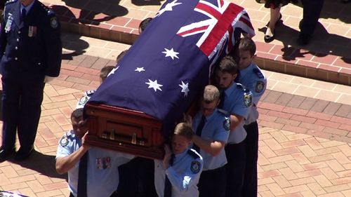 Constable Tim Proctor, 29, was killed in the smash in Sydney’s Lucas Heights earlier this month was awarded two medals posthumously at the service, which brought Liverpool where he worked, to a standstill.