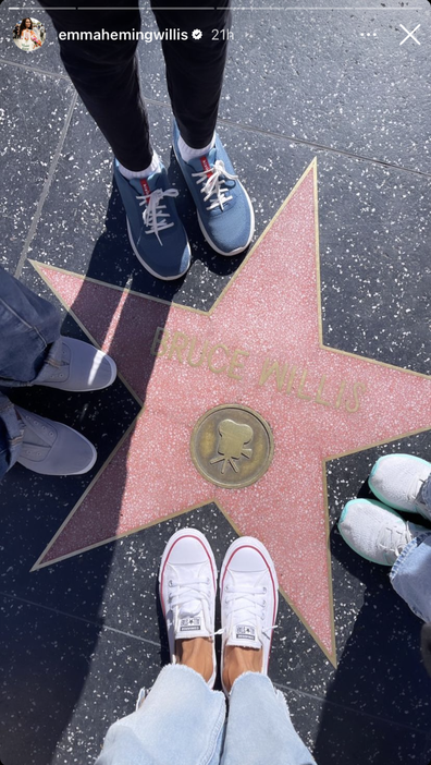 Emma Heming Willis poses besides Bruce Willis' Hollywood star with their two children, Mabel and Evelyn