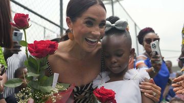 Harry and Meghan meet locals on Nigerian 'tour'