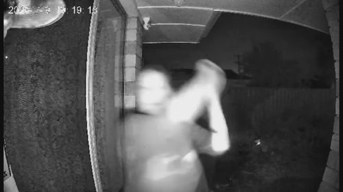 An Adelaide family has allegedly been terrorised in their own home by a neighbour with a baseball bat.The incident was caught on CCTV at the Morphett Vale property on Sunday night.
