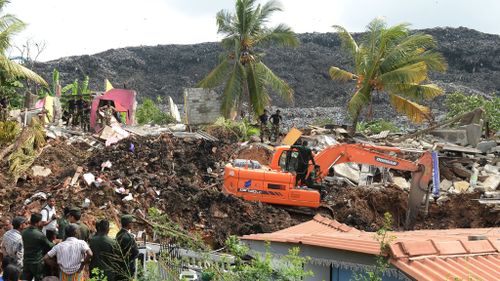 Sri Lankan military rescue workers carry out a rescue operation at the site of a collapsed garbage dump in Colombo. (AFP)