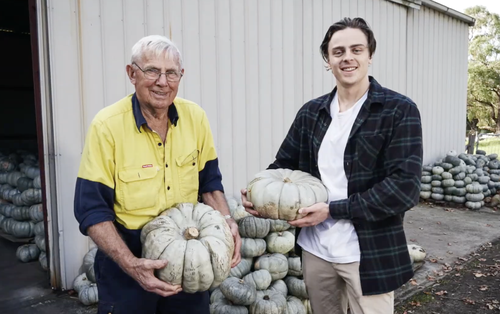 Sprout creator Joe Sinclair (left) with a grower trading pumpkins. 