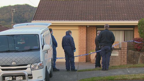 Forensic police examine the Central Coast crime scene where an 82-year-old woman was killed.
