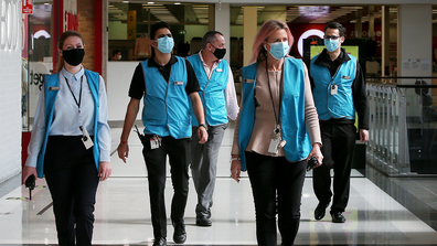 Members of the Broadway Shopping Centre team are seen wearing face masks on August 06, 2020 in Sydney, Australia. 