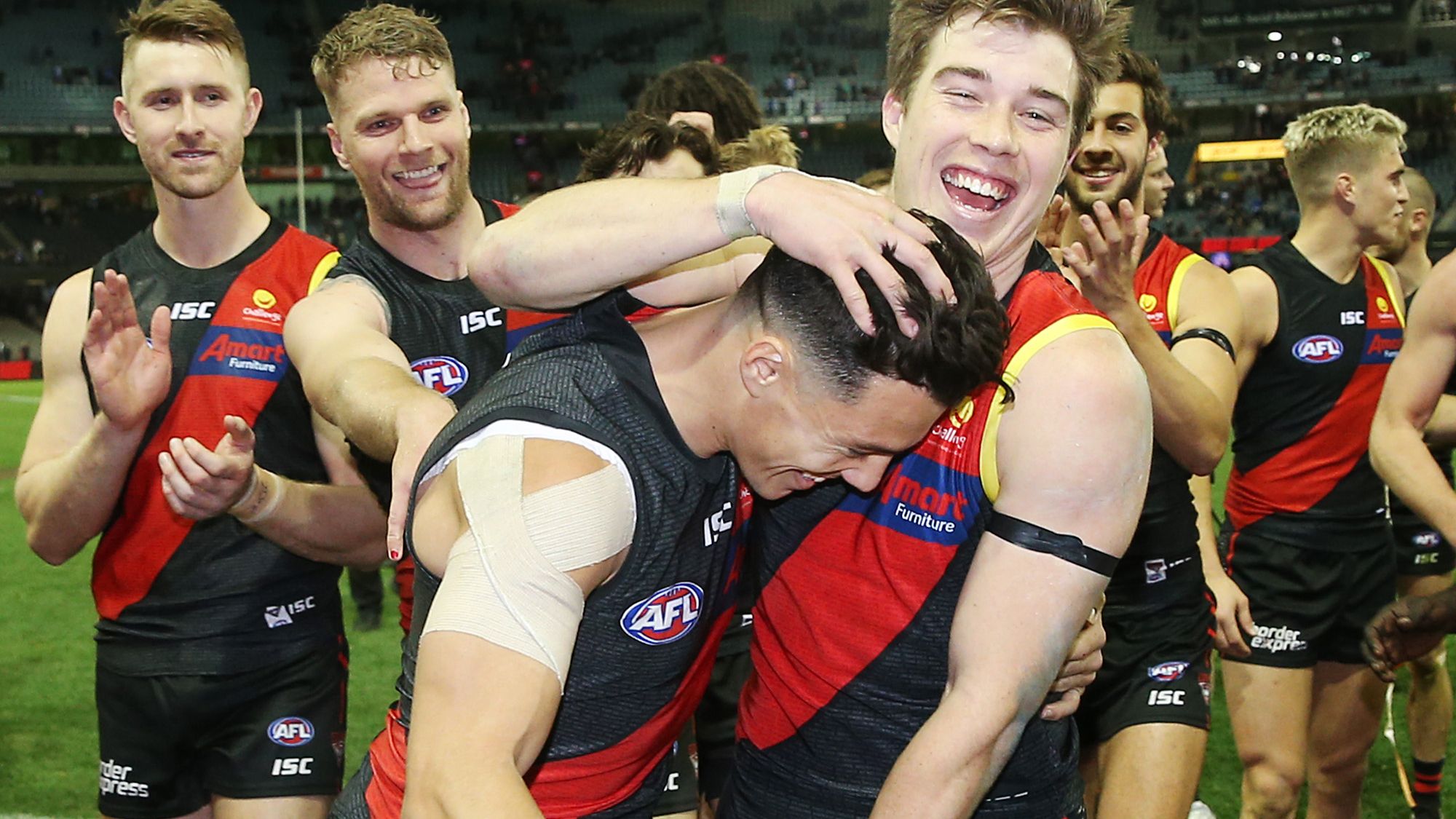 Dylan Shiel and his Essendon teammates celebrate a win.