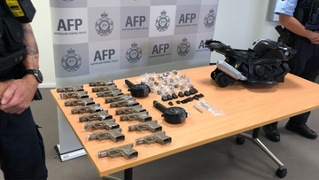 The AFP showcase the array of seized gun parts.