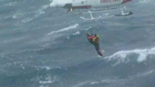 Davidson was dangled out of a helicopter to lift stranded crew from the ocean.