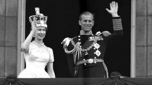 The Queen and Prince Philip wave to the crowds following her coronation at Westminster in 1953. (AFP)