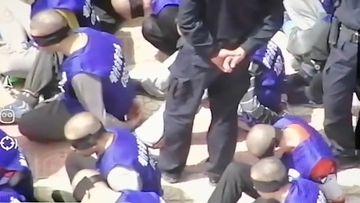 Disturbing video shows hundreds of blindfolded prisoners in China