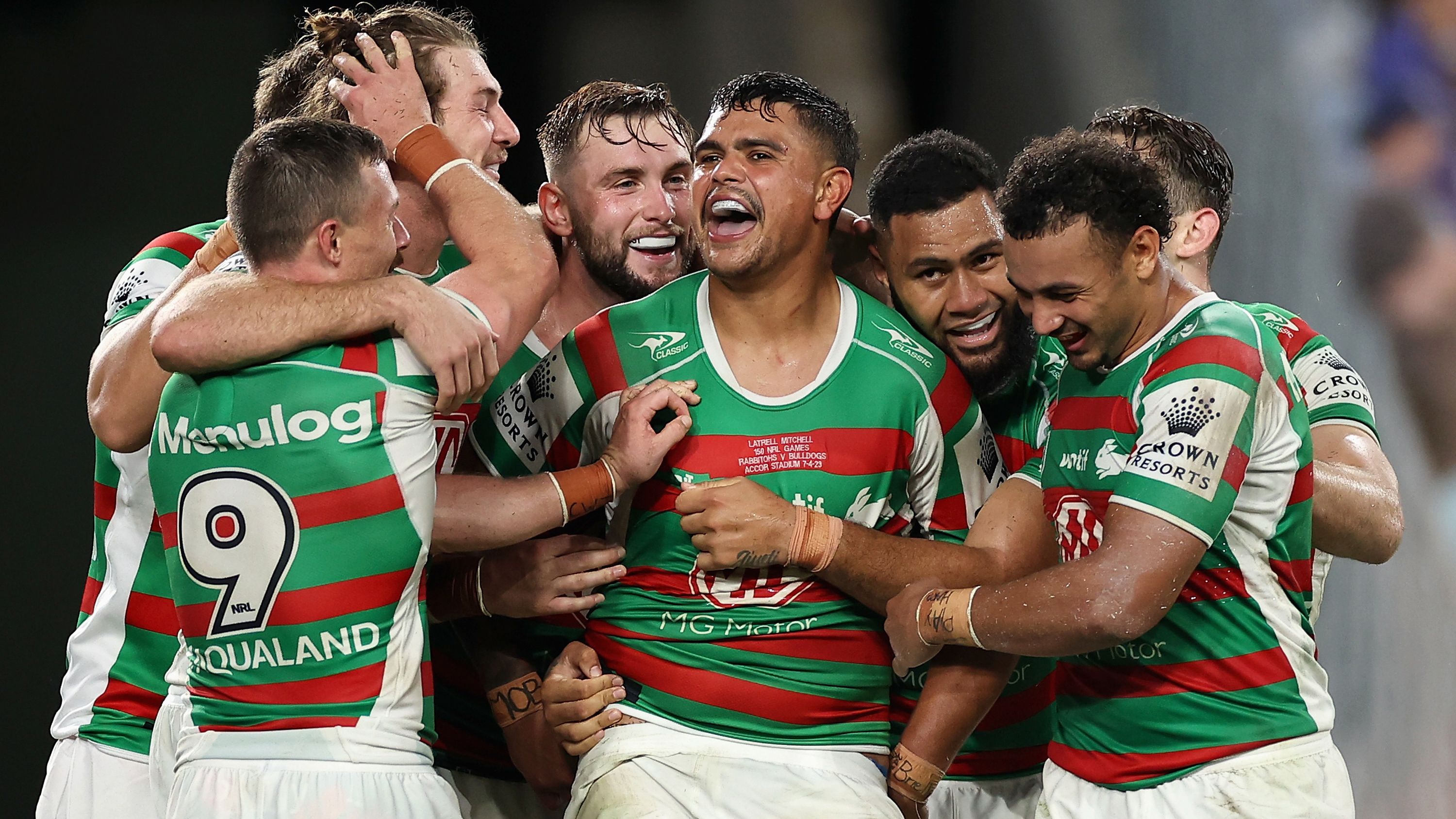Latrell Mitchell of the Rabbitohs is embraced by team mates after setting up a try during the round five NRL match between Canterbury Bulldogs and North Queensland Cowboys at Accor Stadium on April 02, 2023 in Sydney, Australia. (Photo by Cameron Spencer/Getty Images)