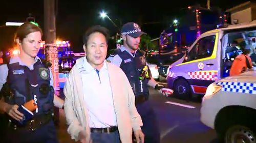 A man was filmed laughing during his arrest after a car crash in south Sydney. (9NEWS)