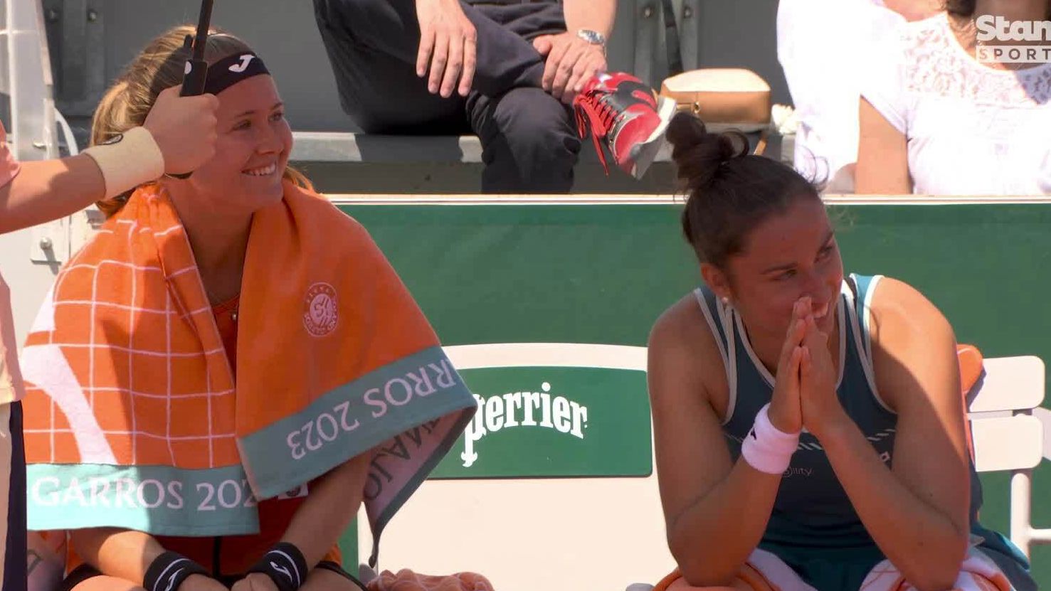 Marie Bouzkova and Sara Sorribes Tormo smiling after their opponents were defaulted for hitting a ball girl at Roland-Garros