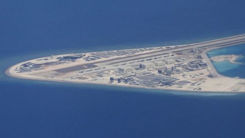 File photo, from 2017, of an airstrip, structures, and buildings on China's man-made Subi Reef.