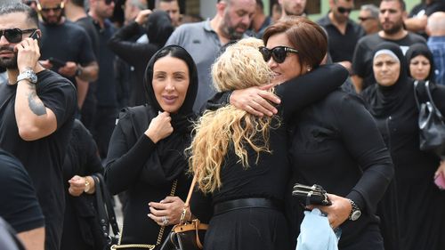 Mourners leave after the funeral of Mahmoud 'Mick' Hawi at the Fatima Al-Zahra Masjid (mosque) in Arncliffe. (AAP)