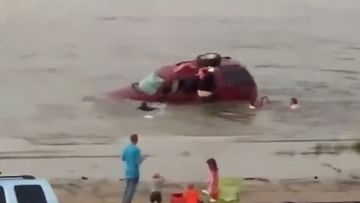 Harley Day rescuing his daughters from a sinking car.