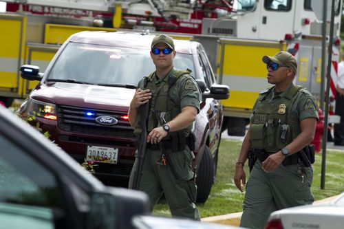 Police have swarmed on the area to lock down the surrounding streets. Picture: AP