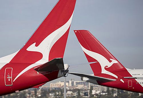 Qantas jet tails at Sydney Airport (Getty)